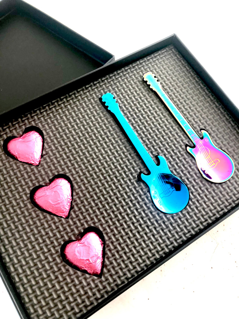 Blue guitar spoon and pink guitar spoon